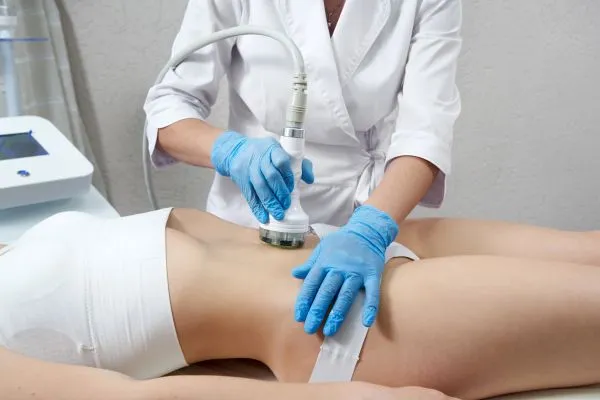 Lost the Weight but Not the Loose Skin? 2 woman having HIFU treatment on her stomach to combat loose skin Maldon following weight loss